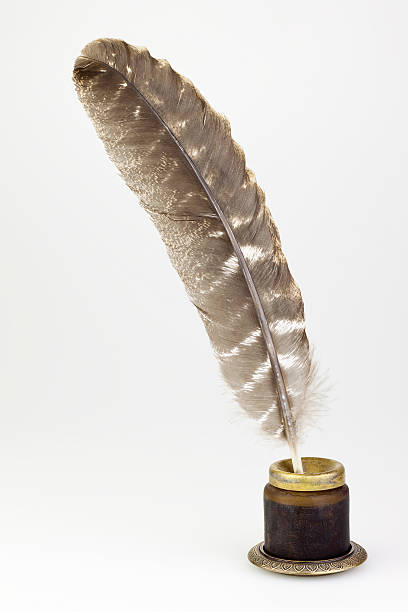 vintage glass inkwell and old pen isolated