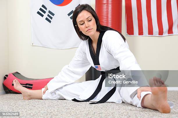Basics Of Stretching Stock Photo - Download Image Now - Adult, Black Belt, Combat Sport