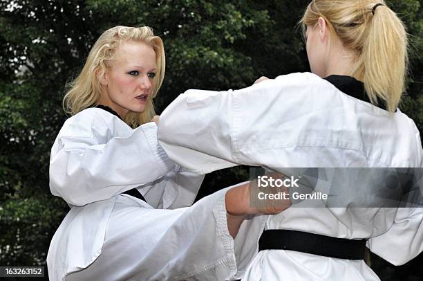 Self Defense Outdoor Partner Training Stock Photo - Download Image Now - Black Belt, Blond Hair, Capital Cities