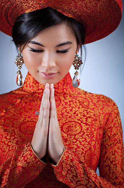 Young vietnamese woman in traditional clothing portrait.