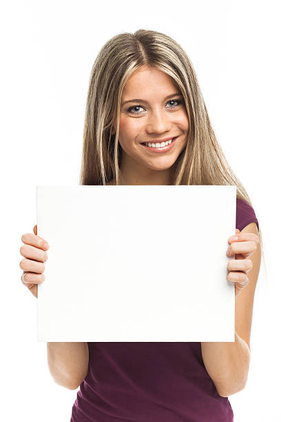 istock Young blond woman showing blank signboard 163266217