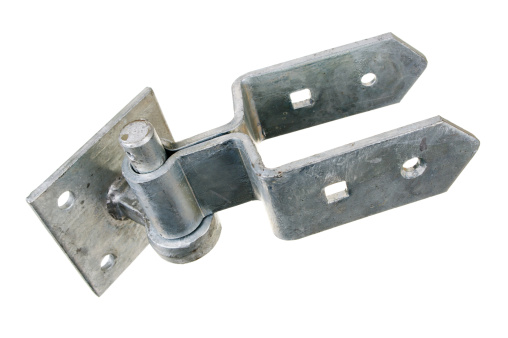 A galvanised hinge for a field gate.