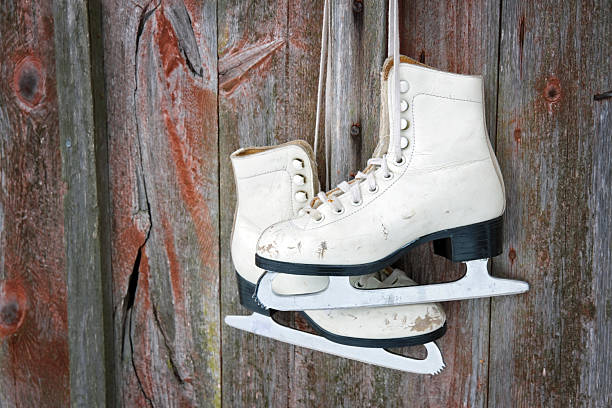 istock Old skates hanging on a wooden wall 163267051