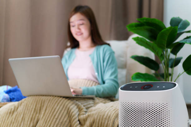 istock Woman working in living room 1632674168