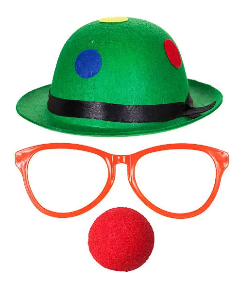 Clown hat with glasses and red nose isolated on white background