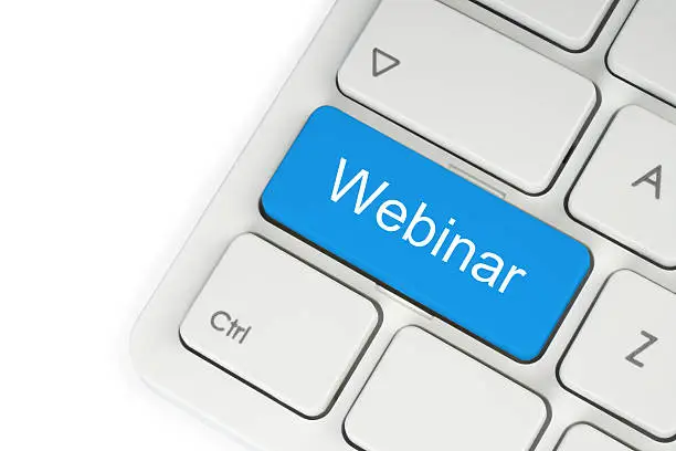 Photo of Blue webinar button on keyboard