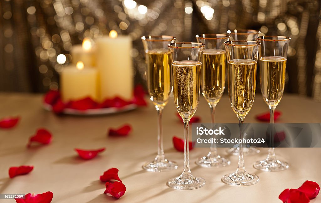 Gold glitter Wedding reception setting with champagne Gold glitter Wedding reception setting with champagne and candles Alcohol - Drink Stock Photo