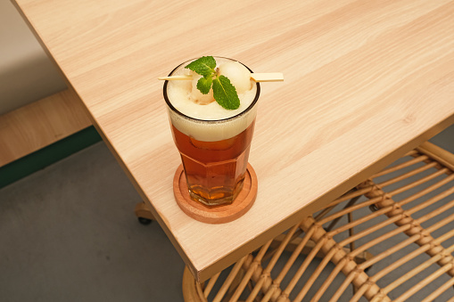 Lychee iced tea with mint leaves