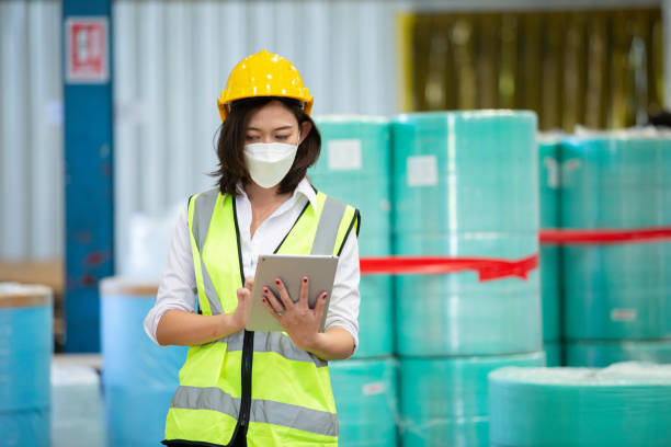 istock Female professional worker use tablet checking stock product in warehouse logistic storage. woman employee  checklist package delivery factory. 1632749779