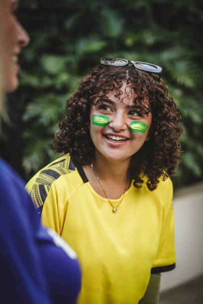 Woman walking to game in team colours