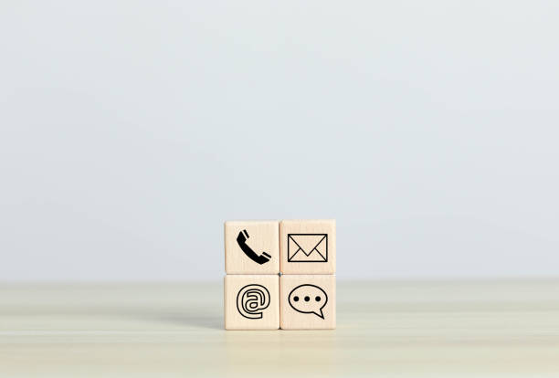 istock Businessman using contact icon, virtual screen, contact us or connect customer support hotline, contact, customer, phone, support, online, on wooden log 1632758597