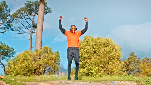 Nature mountain, black man running and celebrate exercise achievement, training workout or sports cardio success. Excited, cheers and African male runner happy for endurance challenge celebration