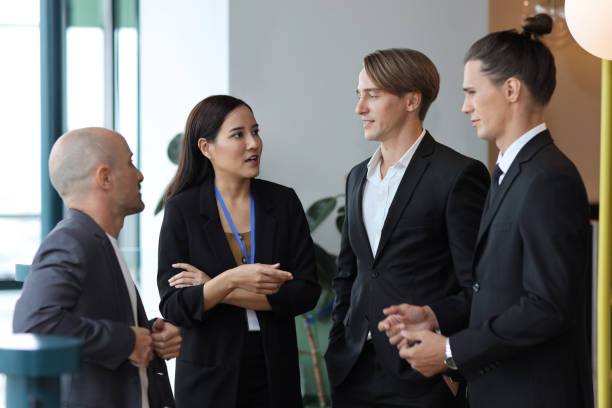 istock Collaborative process of multiethnic business people team working together discussing, researching, brainstorming and planning work at business meeting in modern office building and city background 1632889352