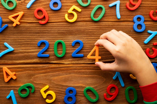 istock hild makes up the year 2024 from multi-colored numbers on a wooden background 1632895252