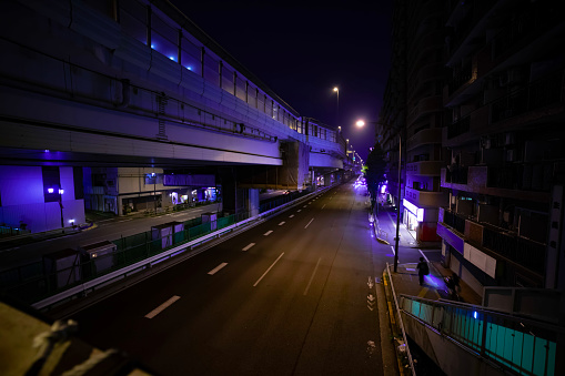 A night timelapse of the traffic jam at the city street under the highway. High quality photo. Shibuya district Sasazuka Tokyo Japan 07.07.2023 It is center of the city in Tokyo.