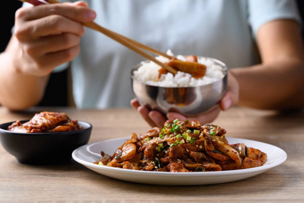 istock Korean stir fried kimchi cabbage with pork eating with kimchi and cooked rice 1632897322