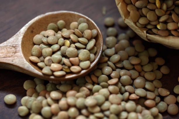 istock Lentils spilling out of a paper bag 1632925365