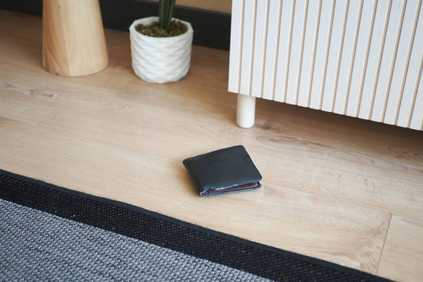 istock left wallet on floor at home 1632971838