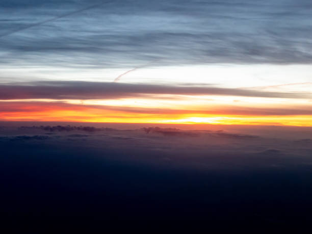 istock Sky and clouds on sunrise from airplane 1632985066