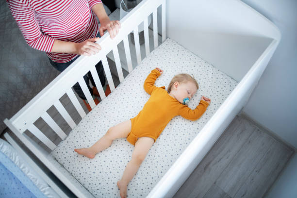 istock Mother watching her baby boy sleeping. 1632987806