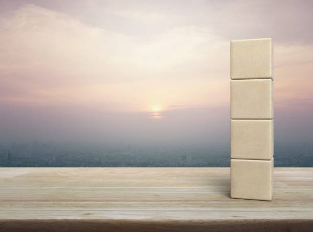 istock Four wood block cubes on wooden table 1632995312