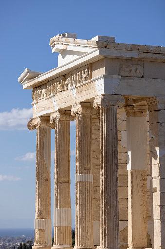 Athens, Greece - October 17, 2022: Temple of Athena Nike at Propylaia, monumental ceremonial gateway to the Acropolis of Athens