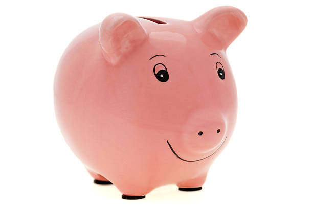 isolado rosa piggy bank - piggy bank gold british currency pound symbol - fotografias e filmes do acervo
