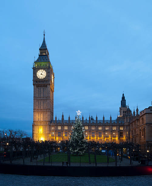 istock Big Ben in London with Christmas tree at dusk 163301590