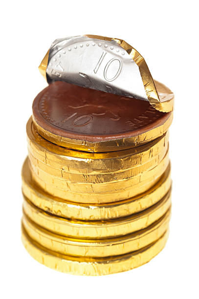 istock Chocolate money coins stacked on white 163301636