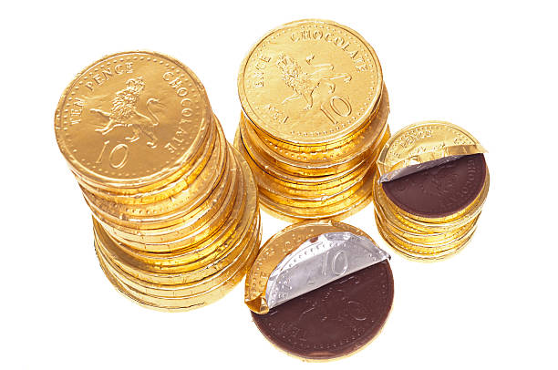 istock Chocolate money coins stacked on white 163301637