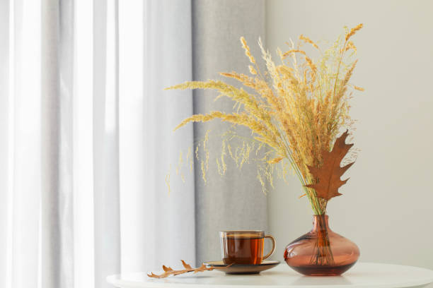 istock cup of tea and autumn decor in modern interior 1633025099