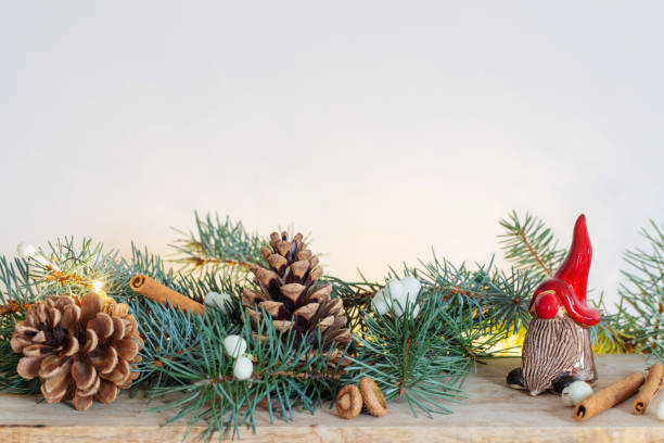 istock ceramic gnome in red hat with christmas branches and natural decor 1633025296