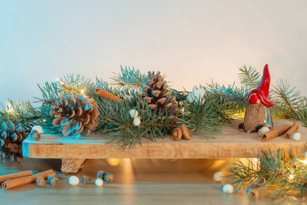 istock ceramic gnome in red hat with christmas branches and natural decor 1633025596