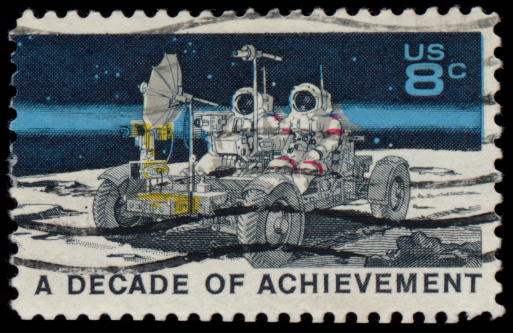 Vintage US postage stamp celebrating the apollo moon missions - 8 cents - A dacade of achievement