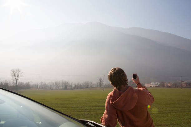 istock Young man takes picture with cell phone 163305311
