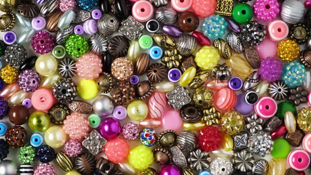 Charms, beads for self-manufacture of bracelets, Necklace or beads and other jewelry. 4K Video, Rotating