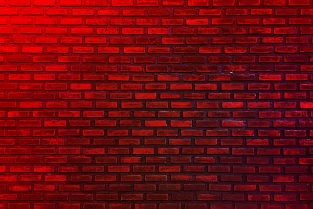 istock Background of empty brick wall with red neon light, 80s style glow 1633144801