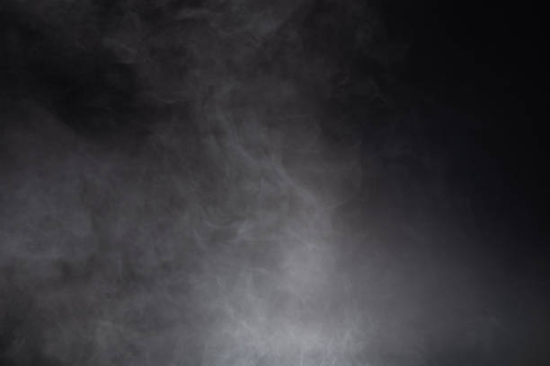 istock White and gray smoke against black background 1633155629