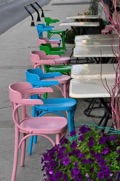 istock colorful chairs in a sidewalk cafe 1633160392