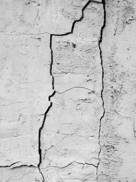 istock Crack Broken Rock Cement Floor Wall Background, Surface Texture Stone Damage Earthquake Effect Plaster Stucco Abstract Split Structure Backdrop, Cracked Concrete White Grey Vintage Construction 1633169911