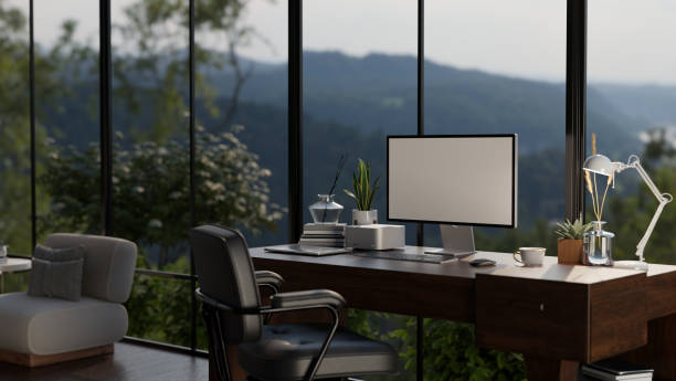 istock A computer desk with a computer in a modern, luxury living room. Home workspace 1633177040