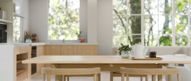 istock Copy space on a minimal wooden dining table in a minimal Scandinavian kitchen 1633180939