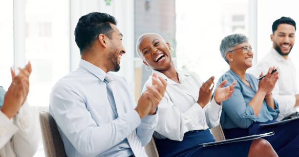 istock Diversity, business people and applause presentation, employee support and happiness in office. Interracial teamwork, clapping hands and audience smile for workshop achievement or goals celebration 1633189143