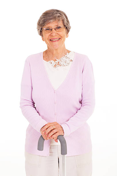 istock happy elderly lady with walking cane 163319031