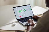 Anonymous African American Man Working From Home on His Laptop Computer (Copy Space)