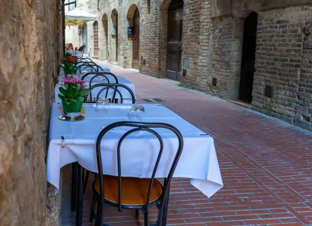 Photo of restaurant in a old Street, Tuscany Italy