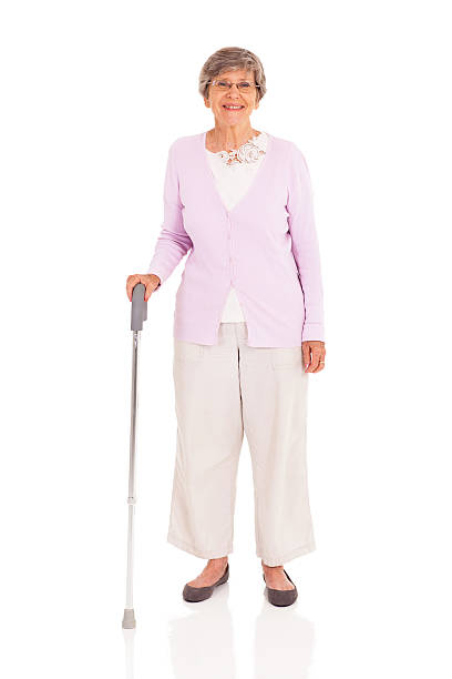 istock senior woman with walking cane 163321053