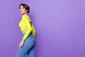 Profile photo of stunning positive lady posing look empty space advertisement wear lime top isolated on violet color background