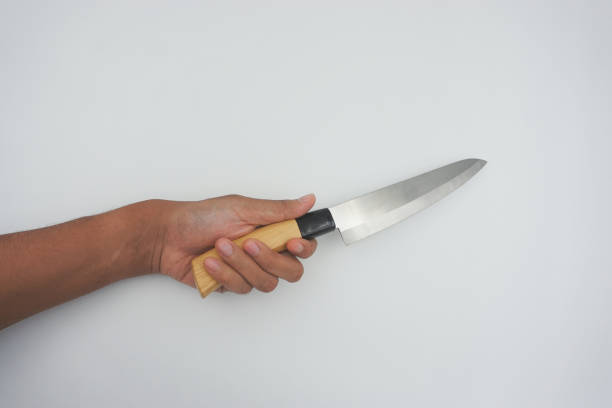 istock hand brandishes a knife 1633233685