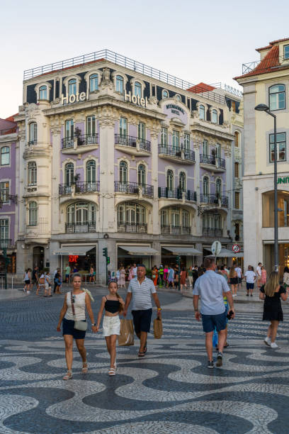 Lisbon, Portugal- Aug 13, 2023: Street view from Praca do Rossio square also known as King Pedro IV Square with beautiful architecture of downtown Lisbon, Portugal